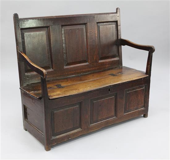 An 18th century oak box seat settle, W.3ft 9in.